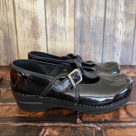 sanita black patent clogs